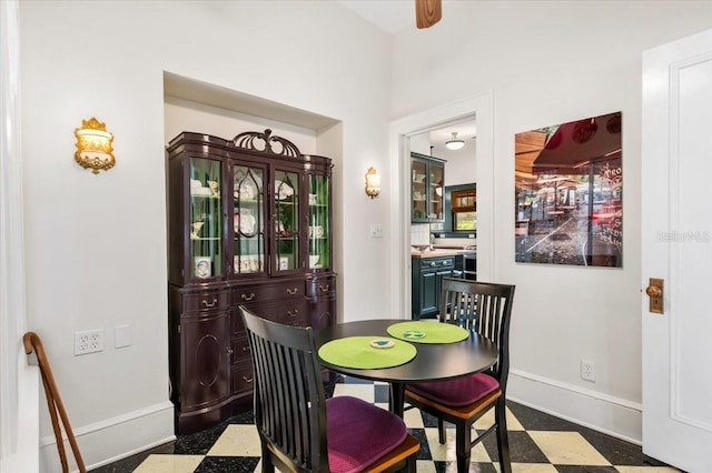 2326 2nd Ave E, Bradenton, FL 34208 - dining space featuring dark flooring, baseboards, and a ceiling fan