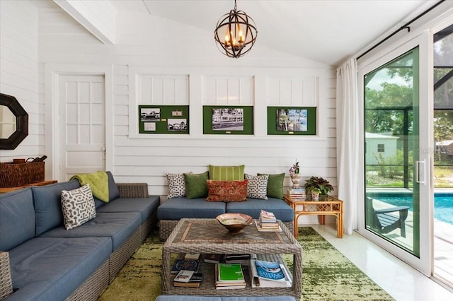 2326 2nd Ave E, Bradenton, FL 34208 - living room with vaulted ceiling and a chandelier