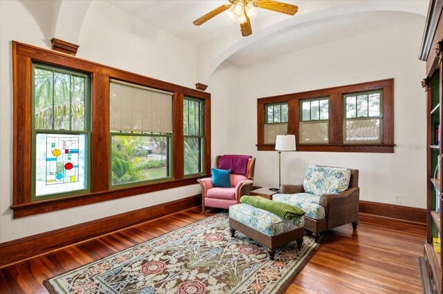 2326 2nd Ave E, Bradenton, FL 34208 - living area featuring arched walkways, hardwood / wood-style floors, baseboards, and a ceiling fan