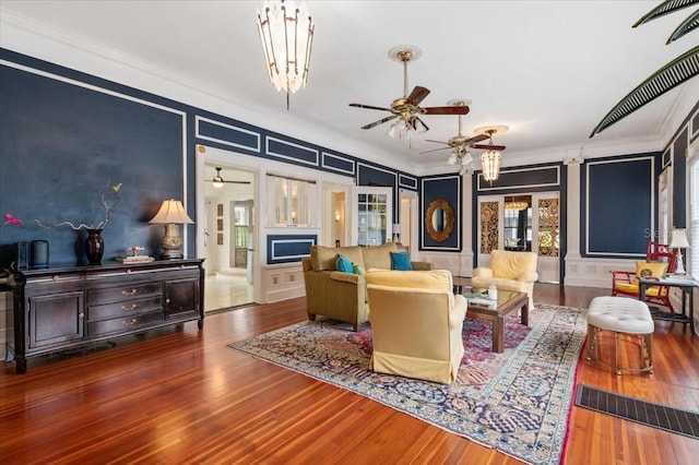 2326 2nd Ave E, Bradenton, FL 34208 - living area featuring ornamental molding, a decorative wall, a ceiling fan, and wood finished floors