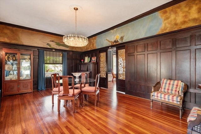 2326 2nd Ave E, Bradenton, FL 34208 - dining space featuring a chandelier, ornamental molding, and wood finished floors