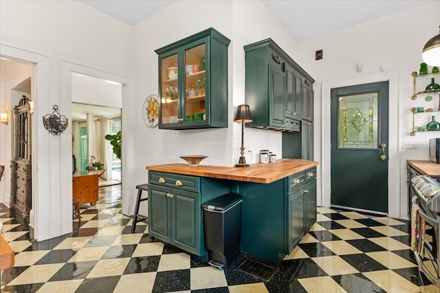 2326 2nd Ave E, Bradenton, FL 34208 - kitchen featuring green cabinets, wood counters, and light floors
