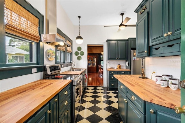 2326 2nd Ave E, Bradenton, FL 34208 - kitchen with butcher block counters, stainless steel electric range oven, a sink, and tile patterned floors