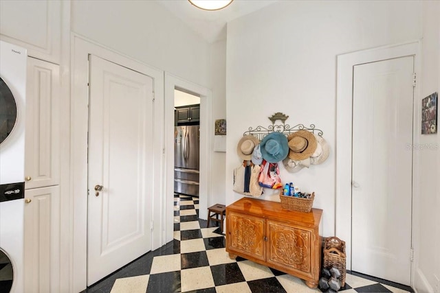 2326 2nd Ave E, Bradenton, FL 34208 - entryway with stacked washer / dryer and tile patterned floors