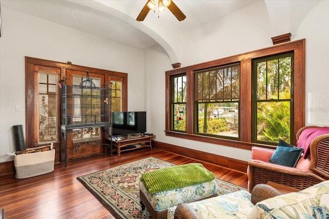 2326 2nd Ave E, Bradenton, FL 34208 - living room featuring arched walkways, wood finished floors, a ceiling fan, and baseboards