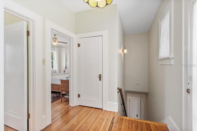 2326 2nd Ave E, Bradenton, FL 34208 - hall featuring an upstairs landing, light wood finished floors, and baseboards