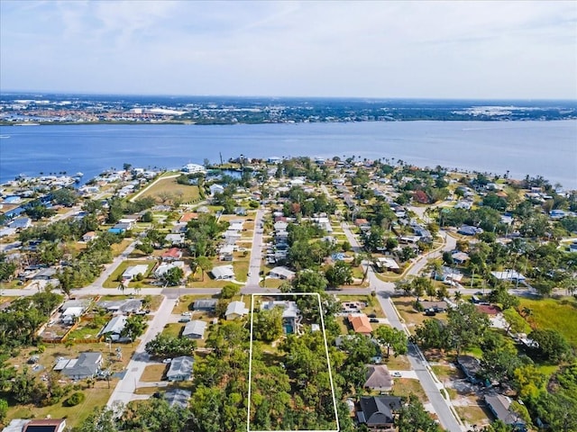 2326 2nd Ave E, Bradenton, FL 34208 - aerial overview of property's location with a large body of water, property parcel outlined, and nearby suburban area