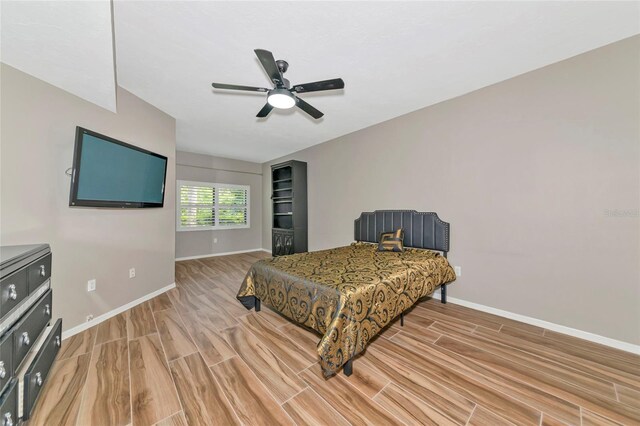 1712 Starling Dr Unit 101, Sarasota, FL 34231 - bedroom featuring baseboards, ceiling fan, and light wood-style flooring