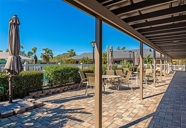 1712 Starling Dr Unit 101, Sarasota, FL 34231 - view of patio with fence and outdoor dining area