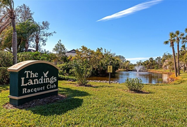 1712 Starling Dr Unit 101, Sarasota, FL 34231 - community / neighborhood sign with a water view and a yard