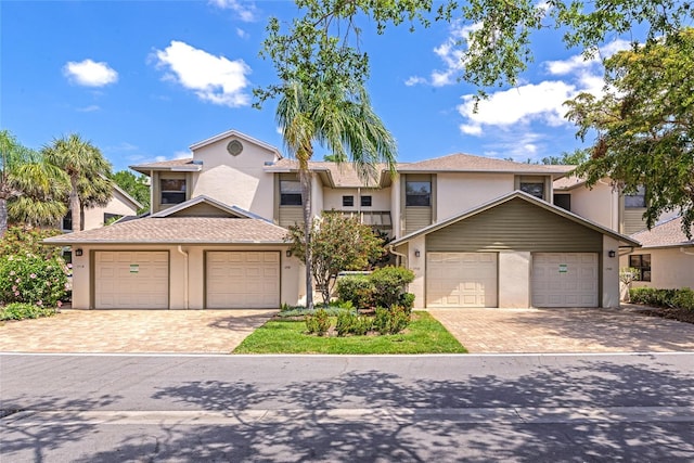 1712 Starling Dr Unit 101, Sarasota, FL 34231 - view of front of property featuring stucco siding and driveway