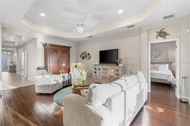 6936 White Willow Ct, Sarasota, FL 34243 - living area featuring baseboards, a raised ceiling, a ceiling fan, visible vents, and dark wood finished floors