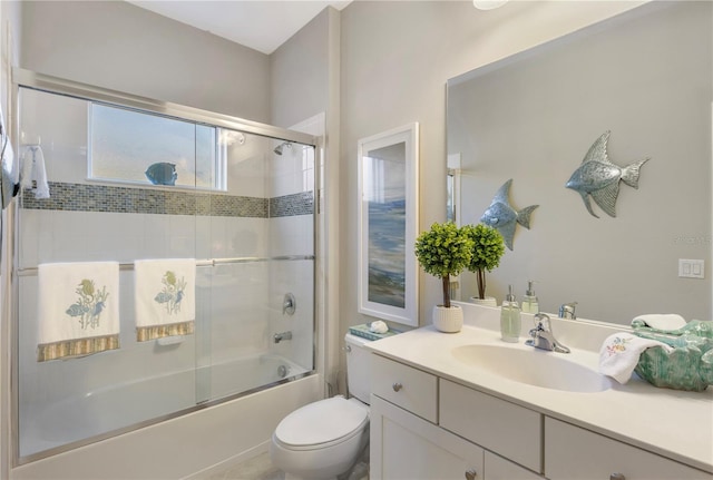 6936 White Willow Ct, Sarasota, FL 34243 - bathroom featuring toilet, combined bath / shower with glass door, and vanity