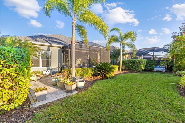 6936 White Willow Ct, Sarasota, FL 34243 - view of yard featuring a patio area and a lanai