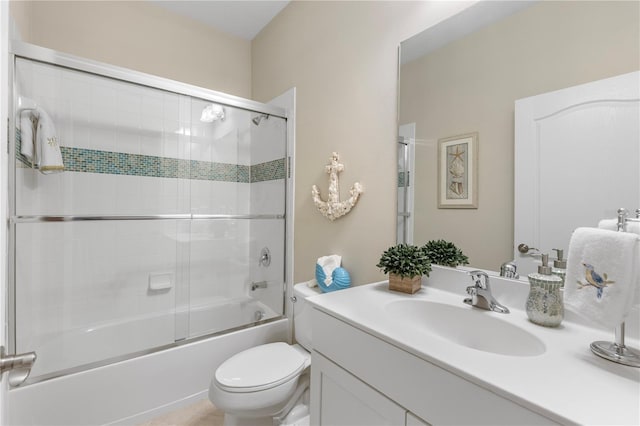 6936 White Willow Ct, Sarasota, FL 34243 - bathroom with toilet, vanity, and enclosed tub / shower combo