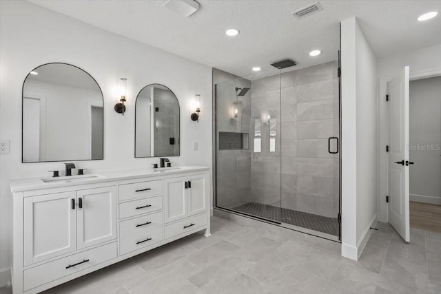2881 48th Way E, Bradenton, FL 34203 - full bath with a shower stall, visible vents, a sink, and recessed lighting