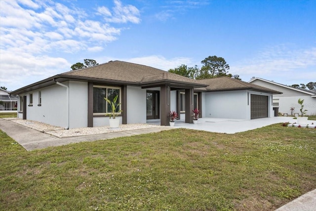 2881 48th Way E, Bradenton, FL 34203 - view of front facade featuring stucco siding, an attached garage, and a front yard