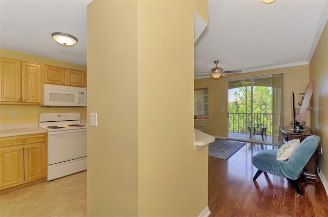 kitchen featuring light countertops, ornamental molding, white appliances, a textured ceiling, and ceiling fan