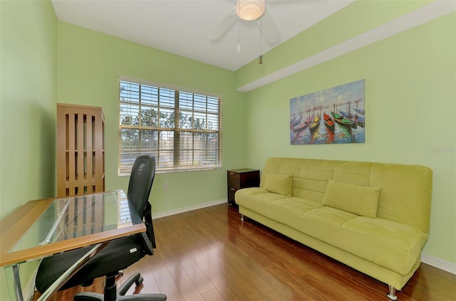 home office featuring baseboards, wood finished floors, and ceiling fan