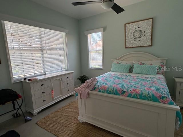 bedroom with carpet flooring and a ceiling fan