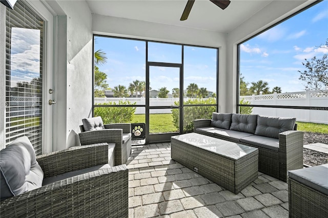 sunroom / solarium with outdoor lounge area and ceiling fan