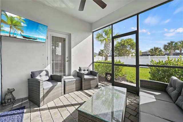 sunroom / solarium with outdoor lounge area and a ceiling fan