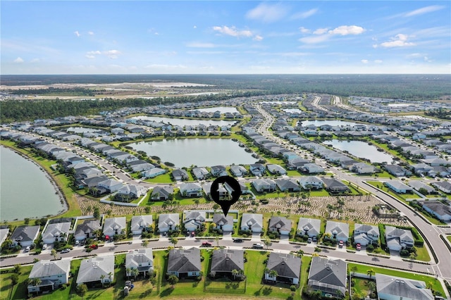 bird's eye view featuring a water view and a residential view