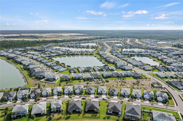 bird's eye view with a residential view and a water view