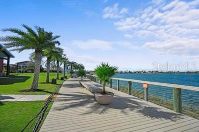 view of community featuring a yard and a water view