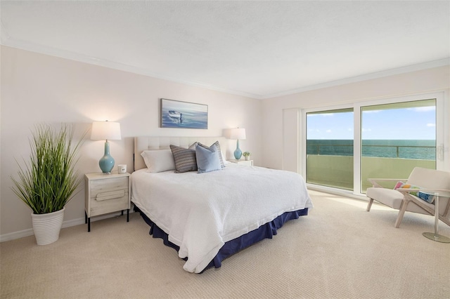 1750 Benjamin Franklin Dr Unit 6B, Sarasota, FL 34236 - bedroom featuring light colored carpet, access to outside, and crown molding