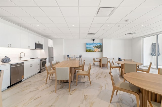 1750 Benjamin Franklin Dr Unit 6B, Sarasota, FL 34236 - dining space featuring recessed lighting and light marble finish flooring