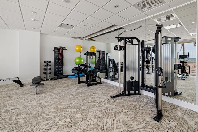 1750 Benjamin Franklin Dr Unit 6B, Sarasota, FL 34236 - workout area featuring carpet flooring and a paneled ceiling