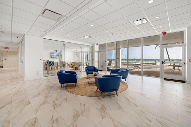 1750 Benjamin Franklin Dr Unit 6B, Sarasota, FL 34236 - lobby with a wall of windows and a drop ceiling