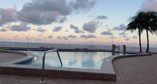 1750 Benjamin Franklin Dr Unit 6B, Sarasota, FL 34236 - pool at dusk with a community pool