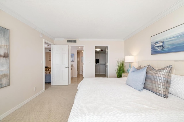 1750 Benjamin Franklin Dr Unit 6B, Sarasota, FL 34236 - bedroom featuring light colored carpet, crown molding, a spacious closet, connected bathroom, and a closet