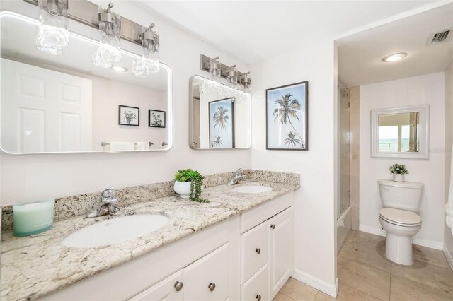1750 Benjamin Franklin Dr Unit 6B, Sarasota, FL 34236 - full bath featuring double vanity, tile patterned floors, and shower / bath combination with glass door