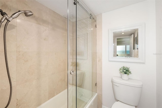 1750 Benjamin Franklin Dr Unit 6B, Sarasota, FL 34236 - full bathroom featuring bath / shower combo with glass door and toilet