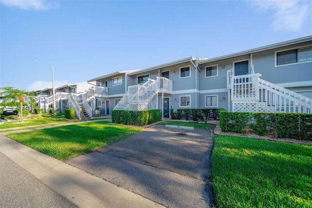 6033 34th St W Unit 132, Bradenton, FL 34210 - view of building exterior with stairway and a residential view