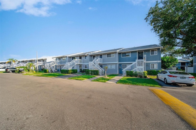 6033 34th St W Unit 132, Bradenton, FL 34210 - view of building exterior featuring stairway and a residential view