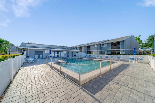 6033 34th St W Unit 132, Bradenton, FL 34210 - community pool featuring a patio area and a fenced backyard