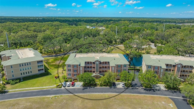 5242 Manorwood Dr Unit 3A, Sarasota, FL 34235 - drone / aerial view featuring a wooded view