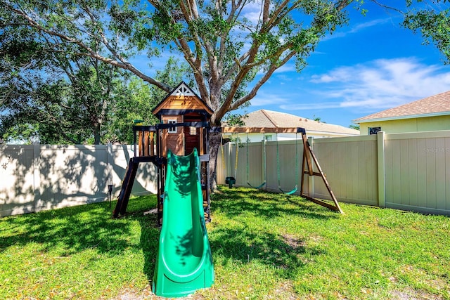 6729 45th Ter E, Bradenton, FL 34203 - view of jungle gym with a yard and a fenced backyard