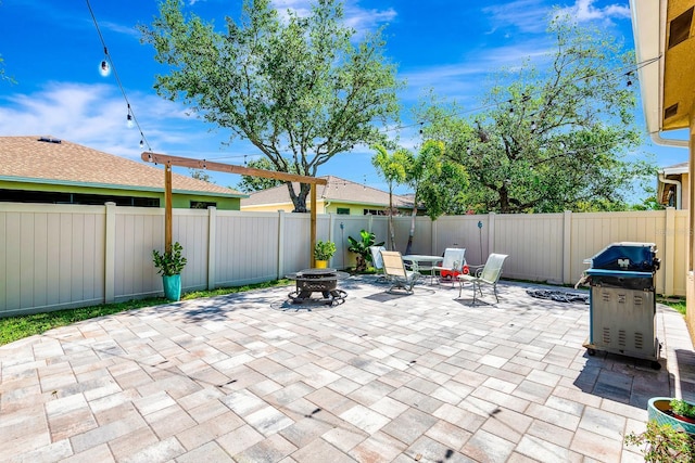 6729 45th Ter E, Bradenton, FL 34203 - view of patio / terrace with an outdoor fire pit, a fenced backyard, and grilling area