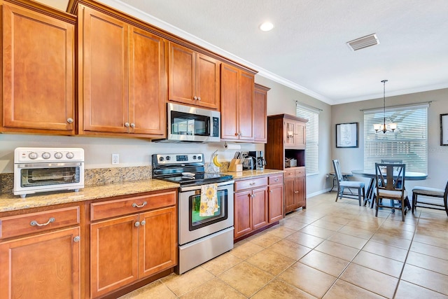 6729 45th Ter E, Bradenton, FL 34203 - kitchen with brown cabinetry, ornamental molding, visible vents, a chandelier, and appliances with stainless steel finishes