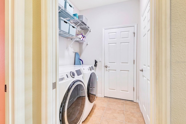 6729 45th Ter E, Bradenton, FL 34203 - washroom featuring light tile patterned floors, separate washer and dryer, and laundry area