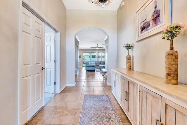 6729 45th Ter E, Bradenton, FL 34203 - hall with arched walkways, light tile patterned floors, and baseboards
