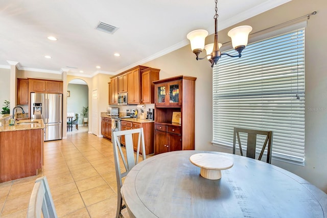 6729 45th Ter E, Bradenton, FL 34203 - dining area with ornamental molding, visible vents, arched walkways, and light tile patterned flooring