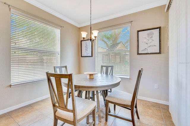 6729 45th Ter E, Bradenton, FL 34203 - dining area with ornamental molding, baseboards, a notable chandelier, and light tile patterned floors