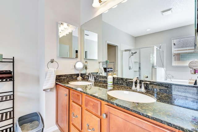 6729 45th Ter E, Bradenton, FL 34203 - bathroom with a stall shower, double vanity, a sink, and visible vents