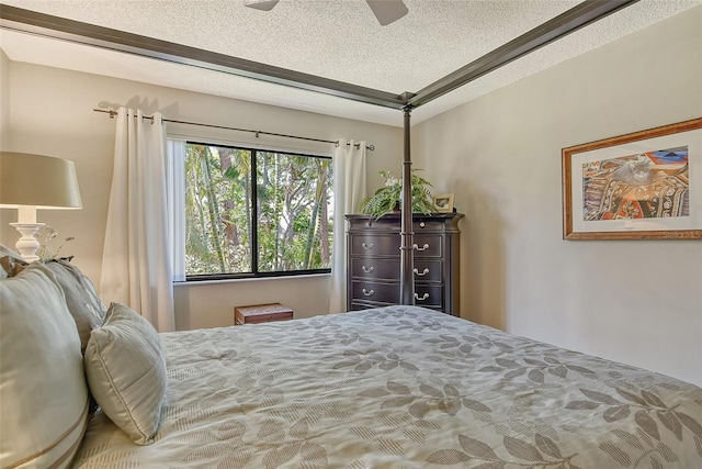 bedroom featuring a textured ceiling and ceiling fan